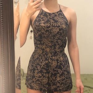 NAVY OUT FROM UNDER FLORAL HALTER SAVANNAH ROMPER